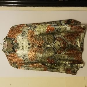 Long-sleeved Silk blouse with floral pattern.